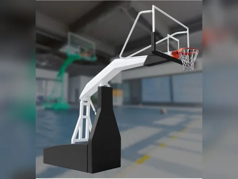 Soporte de básquetbol electrohidráulico de competencia con brazo de 3,35 metros en un gimnasio